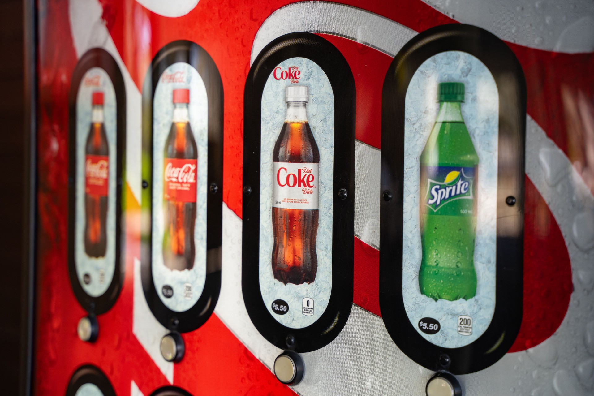 Coca Cola varieties on beverage vending machines. Toronto, Canada - April 30, 2024.